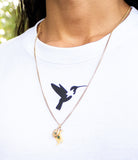 Close-up Bird of Thunder logo on white t-shirt